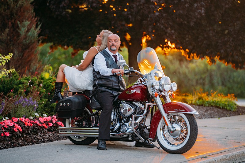 bride and groom riding motorcycle