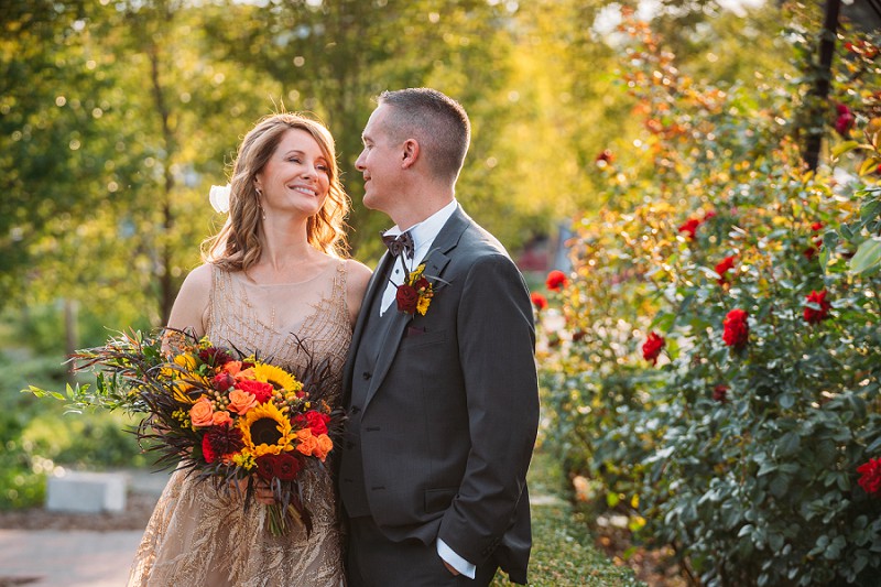 couple in front of rose garden at pillar and post