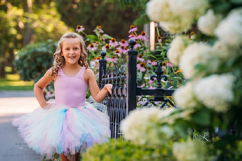 tutu shoot portrait in front of flowers