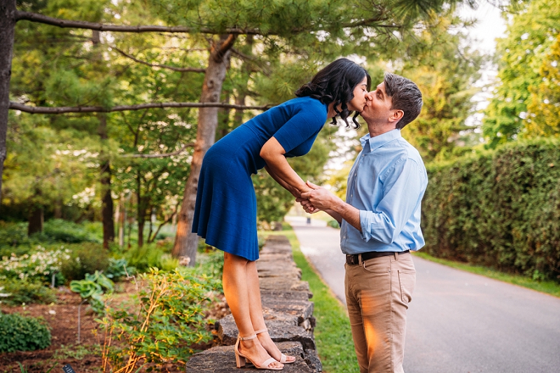 girl bending down to kiss fiance