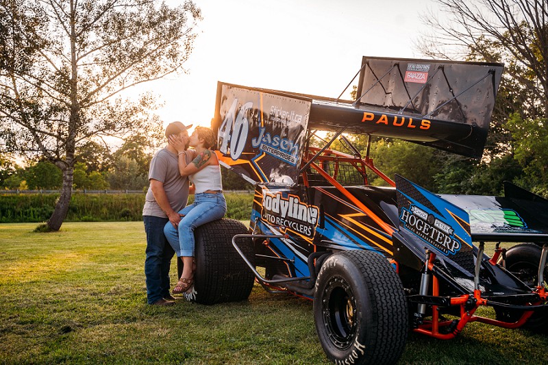couple kissing at sunset