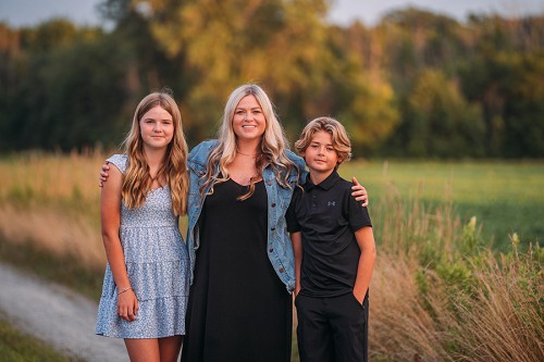 mom smiling with kids