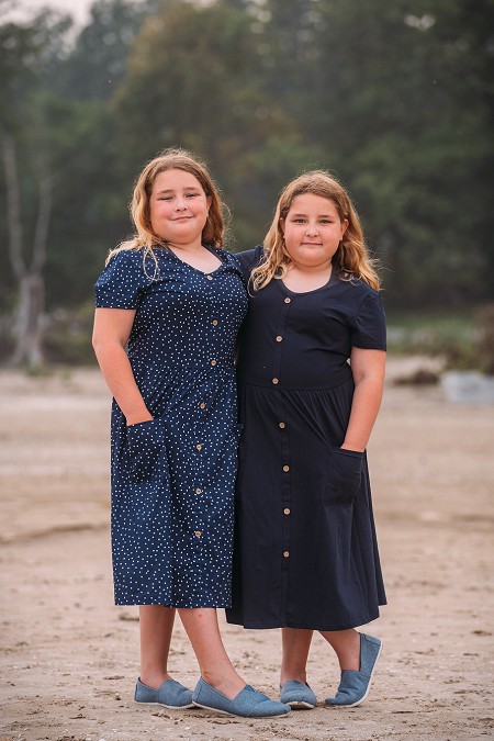 twin sisters smiling