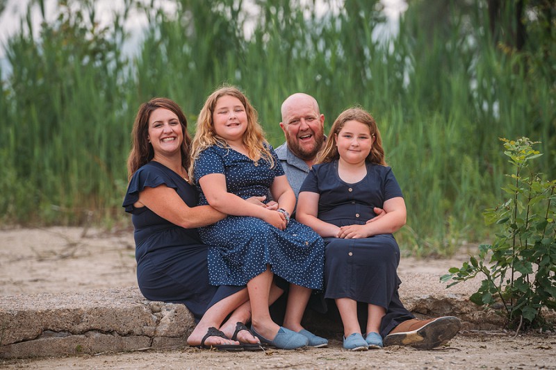 parents and kids sitting and smiling