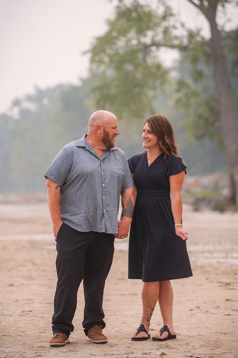 couple holding hands and smiling