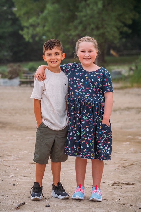 brother and sister smiling at camera