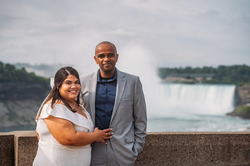 bride and groom smiling at camera