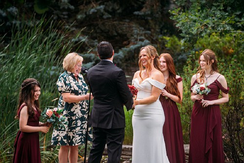 bride smiling at groom during ceremony