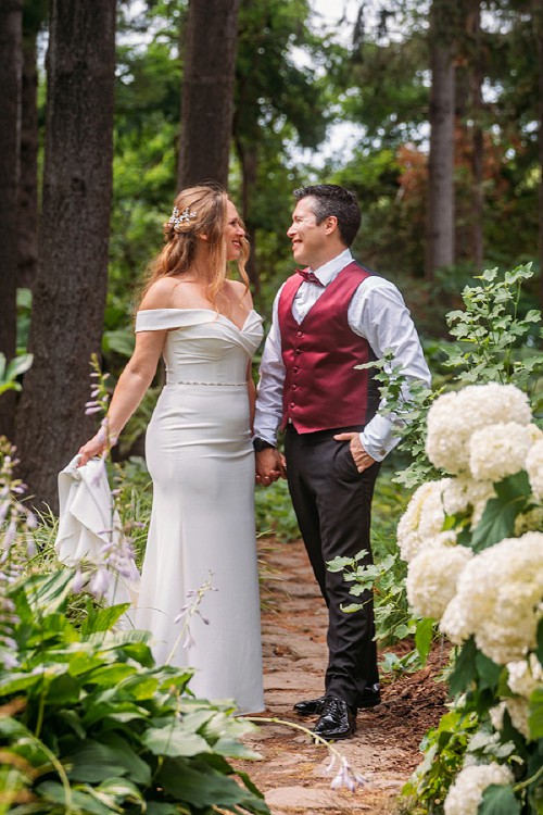 couple surrounded by flowers