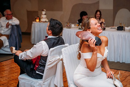 bride laughing during shoe game