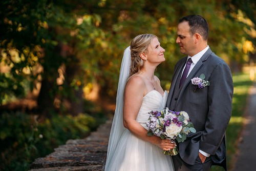 bride and groom smiling at each other