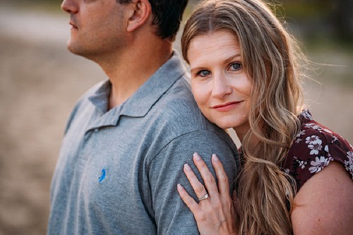 girl resting head on fiance shoulder