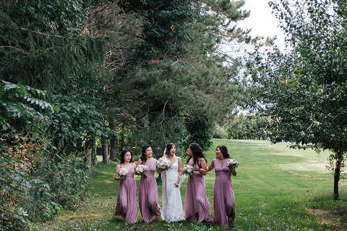 bridesmaids walking at kurtz orchards