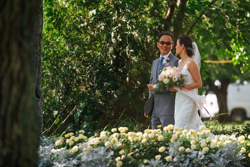 bride and father walking down isle at kurtz orchards