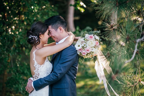 bride and groom holding each other