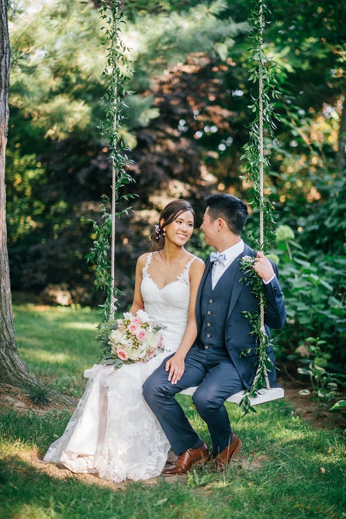 bride and groom on swing set