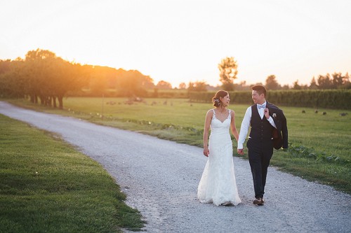 bride and groom walking down pathway