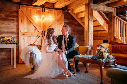 bride and groom inside barn at kehoe and kin