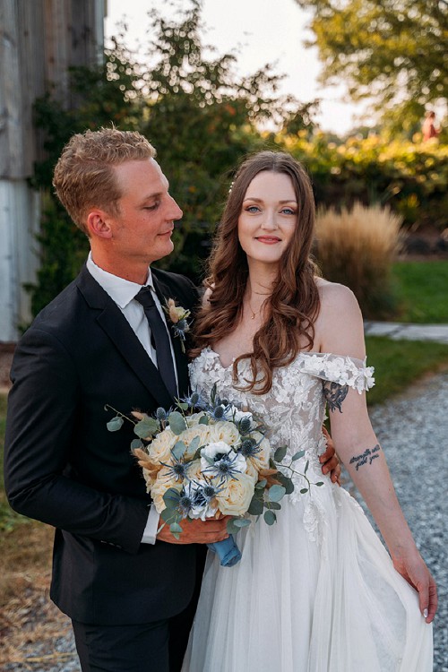 groom smiling at bride