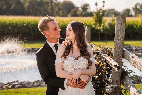 groom hugging bride