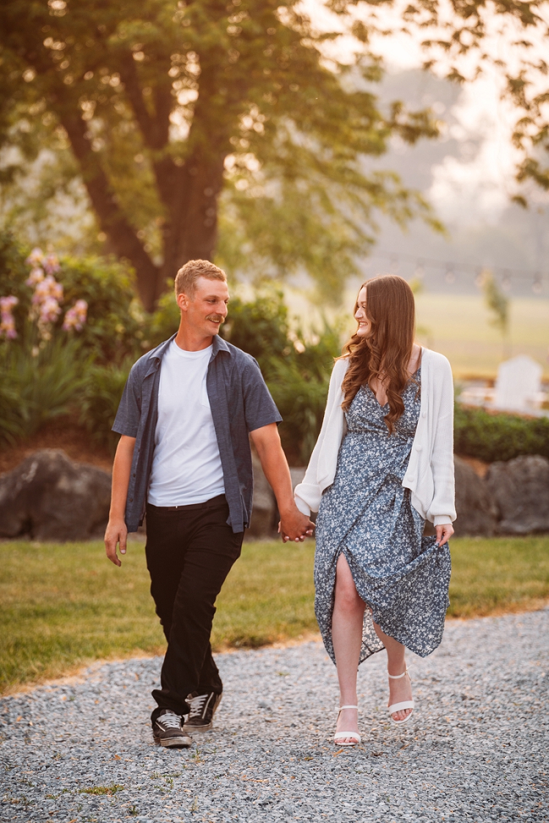 couple holding hands and walking