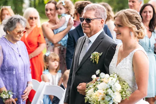 Dad walking bride down aisle