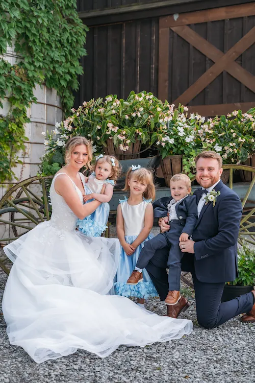 Bride and groom with junior bridesmaids and groomsmen