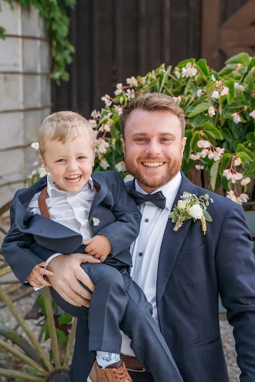 groom and ring bearer laughing