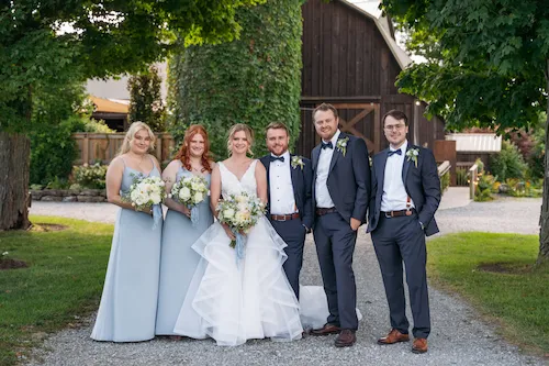 Wedding party group photo on the long driveway at Maple Meadows Farm