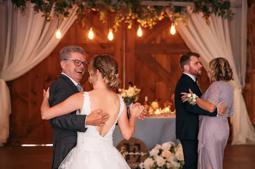 Parent dances in the barn reception at Maple Meadows Farm wedding