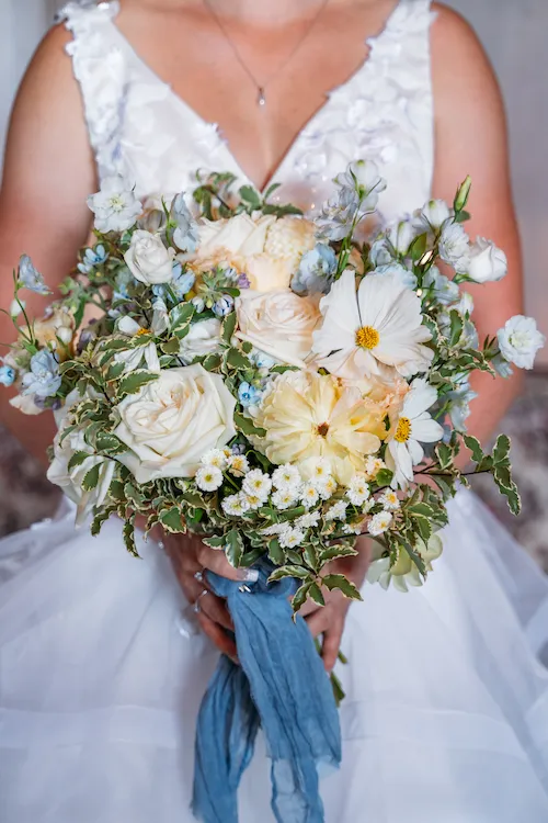 Bride holding flower bouquet