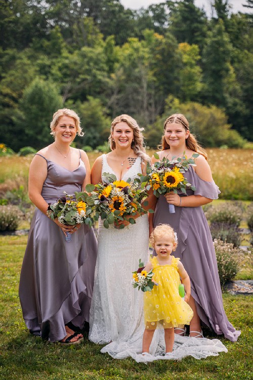bride flower girl and bridesmaids