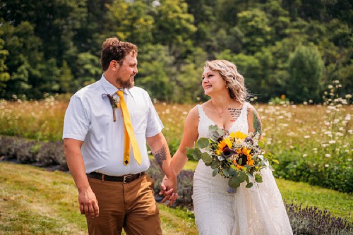 couple holding hands and smiling