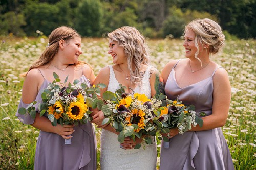 bride and bridesmaids laughing