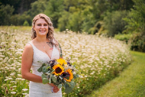 bride with sunflower bouquet