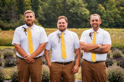 groom and groomsmen smiling