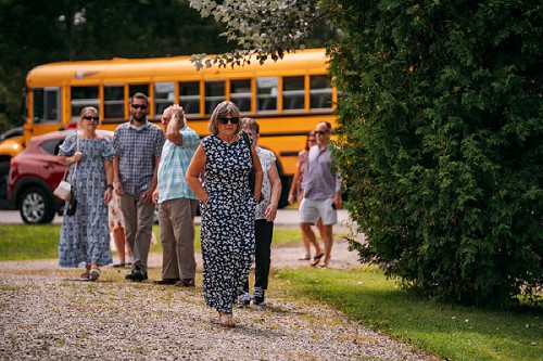 wedding guests arriving on school bus