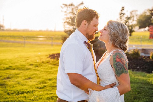 bride and groom at sunset