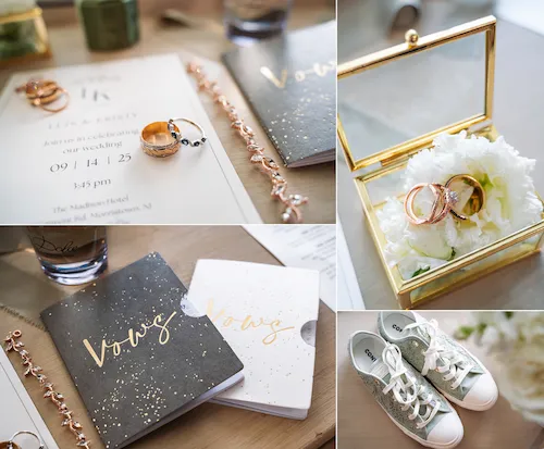 Wedding detail flat lay with invitation, rings, and soft white florals