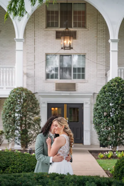 groom making bride laugh