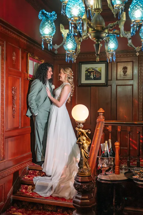 bride and groom on vintage staircase