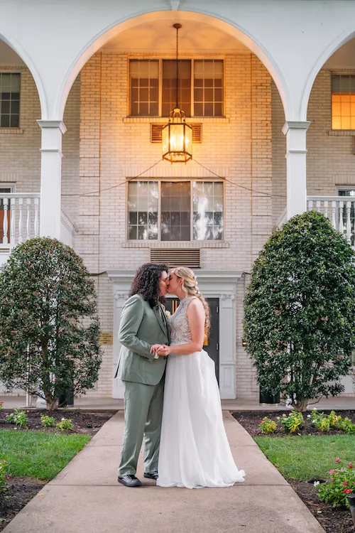 Kissing in front of hotel entrance