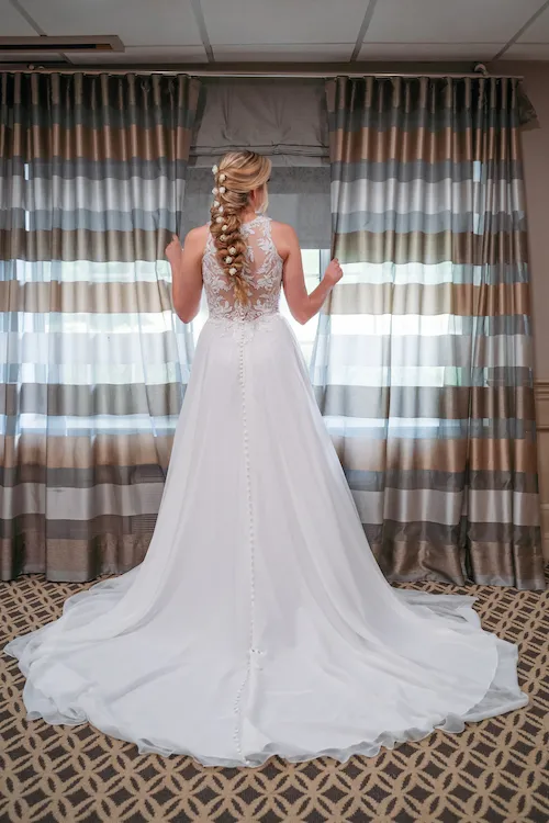 Bridal portrait in front of window at The Madison Hotel, NJ