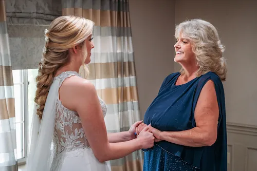 bride and mom first look
