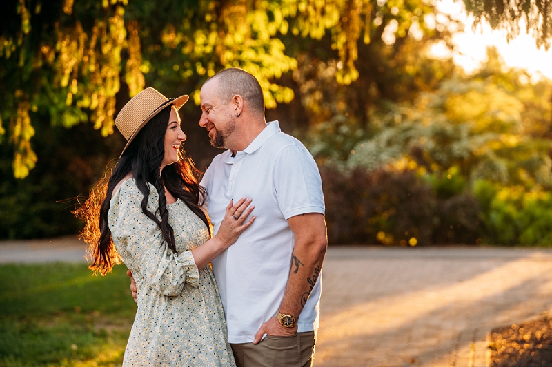 couple staring at each other laughing at sunset