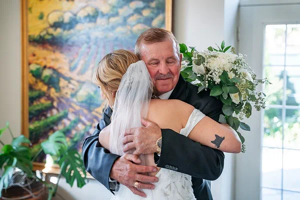 bride and father hugging