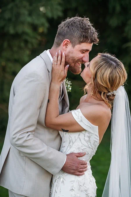 bride and groom kissing after wedding at sue ann winery