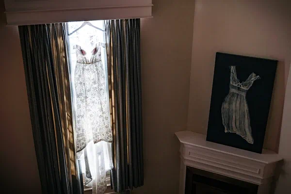 Wedding dress hanging in bridal suite at Inn on the Twenty