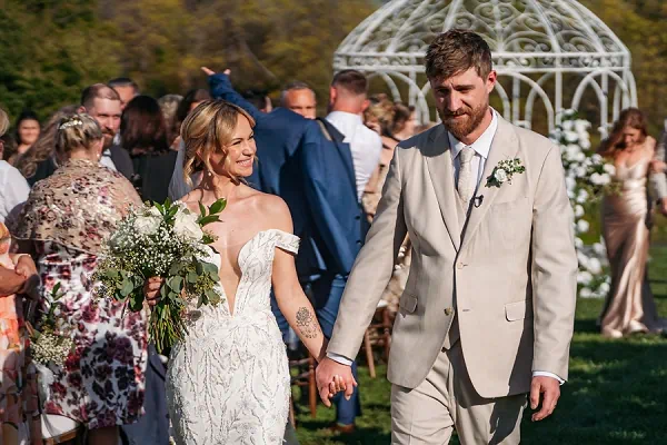 bride and groom walking down aisle