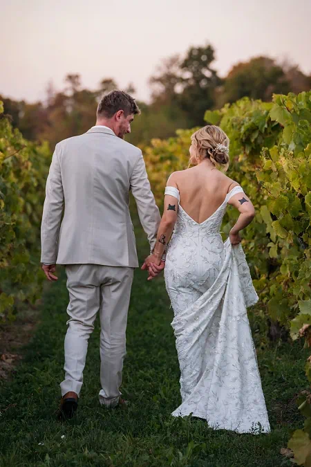 bride and groom in vineyard at sue ann estate winery 